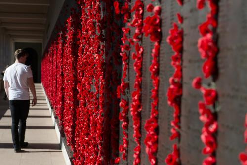 ANZAC DAY at the Australian War Memorial man walking along wall - Australian Stock Image