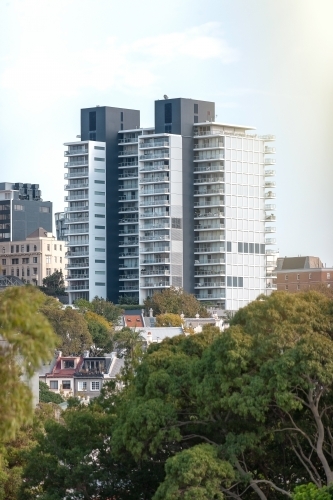 Apartment buildings and terraces among trees - Australian Stock Image