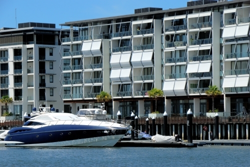 Apartments beside the water with boat