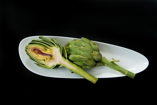 Artichokes on black - Australian Stock Image