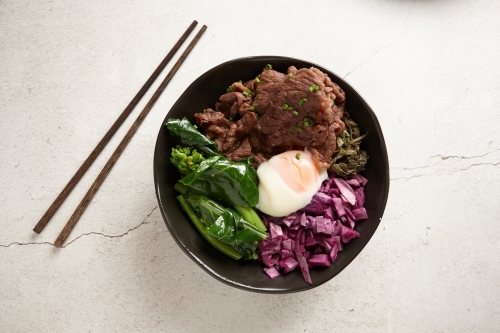 Asian beef soup ingredients in bowl - Australian Stock Image