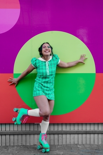asian woman in rollerskates - Australian Stock Image