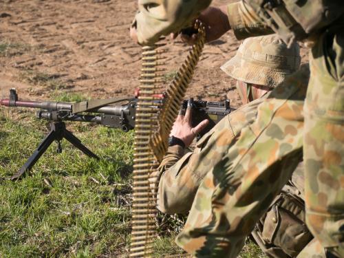 Australian Army Reserve Exercise - Soldier Lying with Gun and Bullets - Australian Stock Image