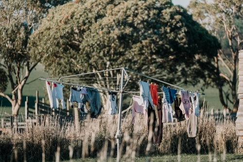 Australian clothes line drying washing in the wind.