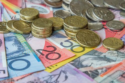 Australian coins sitting on notes - Australian Stock Image
