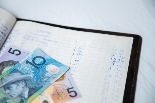 Australian dollar notes on childs budget ledger - Australian Stock Image