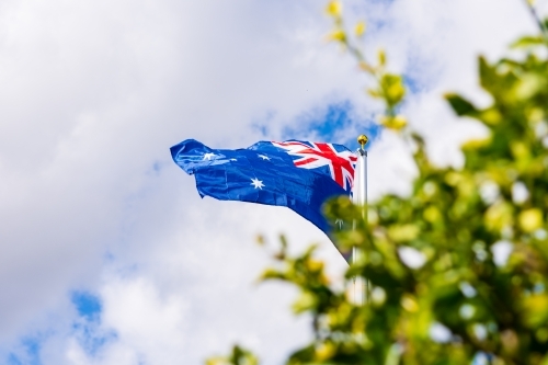 Australian Flag on a Flag Pole flying in the Wind