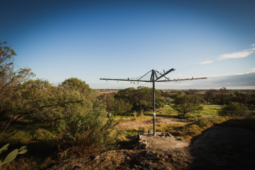Australian Hills Hoist clothes line in country backyard with rural views - Australian Stock Image