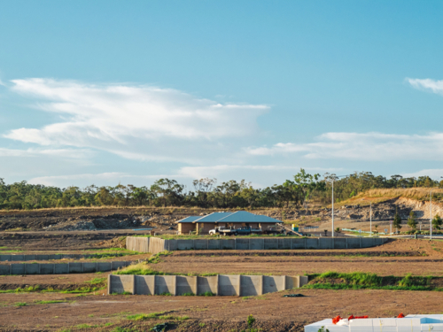 Australian land development with terraced earthworks and building - Australian Stock Image