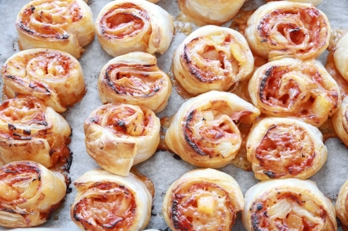 Baked Hawaiian pizza rolls - Australian Stock Image