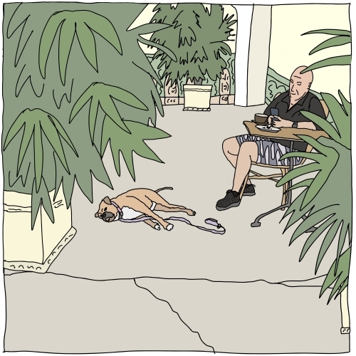 Bald man having coffee with dog resting nearby