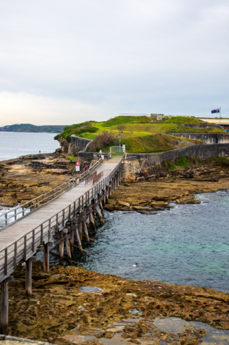 Bare Island and the wooden bridge - Australian Stock Image