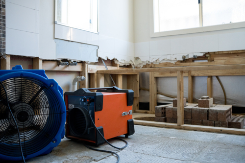 Bathroom renovation - big exhaust fans with bathtub scaffolding - Australian Stock Image