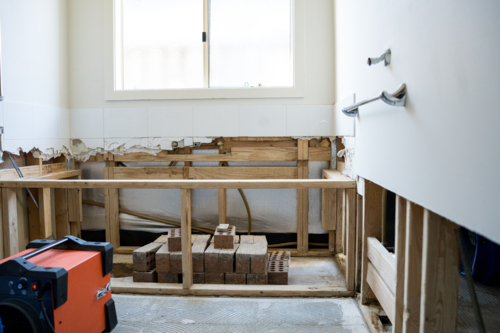 Bathroom renovation - big exhaust fans with bathtub scaffolding - Australian Stock Image