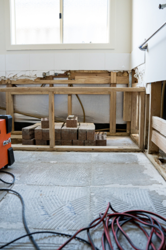 Bathroom renovation - big exhaust fans with bathtub scaffolding - Australian Stock Image