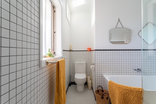 Bathroom renovation featuring toilet and bath - Australian Stock Image
