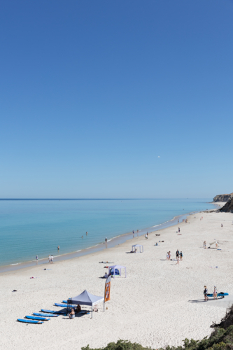 Beach on a clear day with no waves and white sand - Australian Stock Image