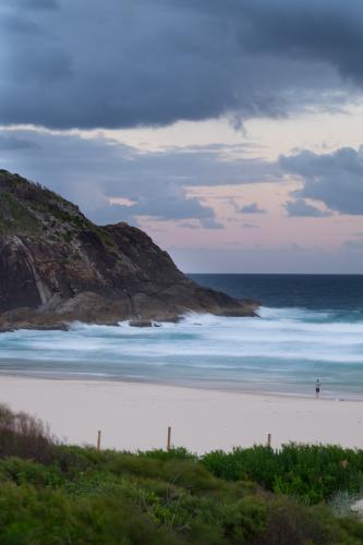 Beach scene with headland and waves - Australian Stock Image