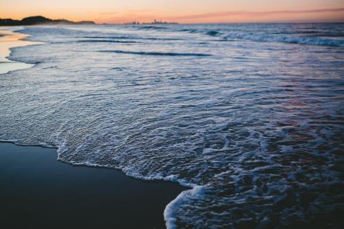 Beach shoreline at sunset