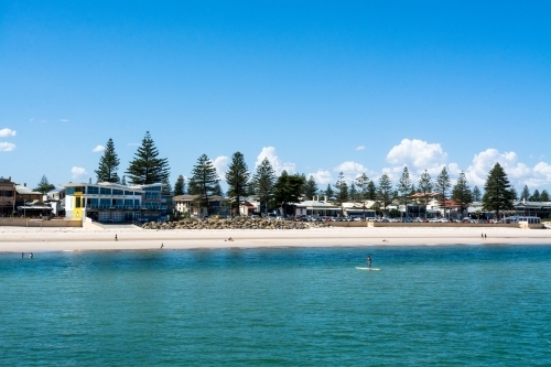 Beach shot with paddle boarder - Australian Stock Image