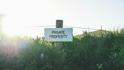 Beach sign with sun glare - Australian Stock Image