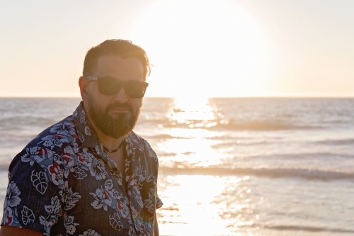 Bearded Man On The Beach At Sunset - Australian Stock Image