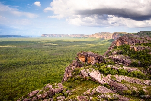 Beautiful light on escarpment with blue stormy sky