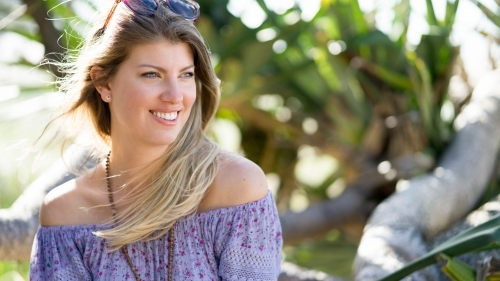 Beautiful woman headshot sitting outdoors - Australian Stock Image