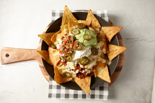 Beef nachos on plate - Australian Stock Image