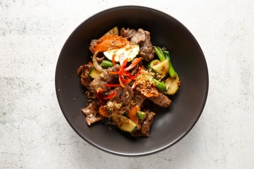 Beef stir fry on table - Australian Stock Image
