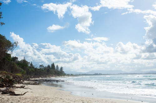 Big sky and waters edge at Byron Bay - Australian Stock Image