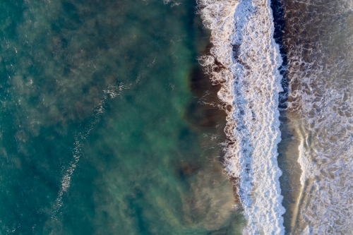 Bird's eye view of a wave on a West Australian beach. - Australian Stock Image