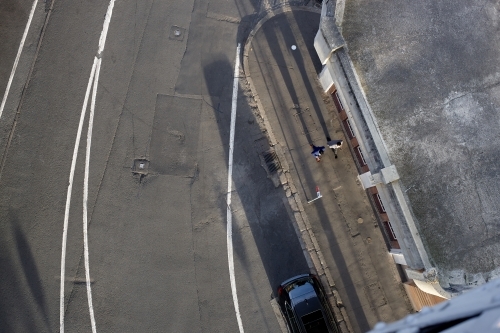 Birds eye view of two businessmen walking on the street - Australian Stock Image