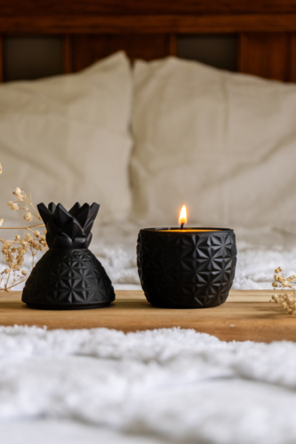 Black decorative pineapple candle - Australian Stock Image