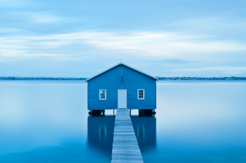 Blue Boat House On River - Australian Stock Image