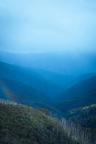 Blue hazy mountains at Mt Hotham with bush - Australian Stock Image