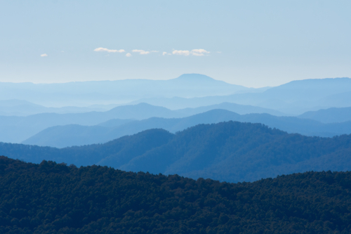 Blue, hazy view of mountain ranges - Australian Stock Image