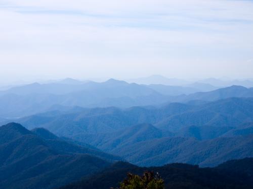 Blue hills receding into the distance with a blue sky - Australian Stock Image