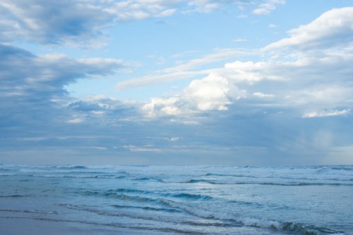 Blue ocean and atmospheric clouds - Australian Stock Image