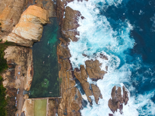 Blue pool and ocean at Bermagui from above - Australian Stock Image