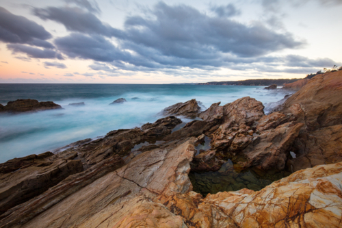 Blue Pool on a cool autumn evening in Bermagui, New South Wales, Australia - Australian Stock Image