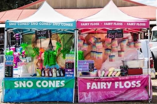 Blue sno cones and pink fairy floss gazebo stands at local show - Australian Stock Image