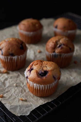 Blueberry muffins on baking paper - Australian Stock Image