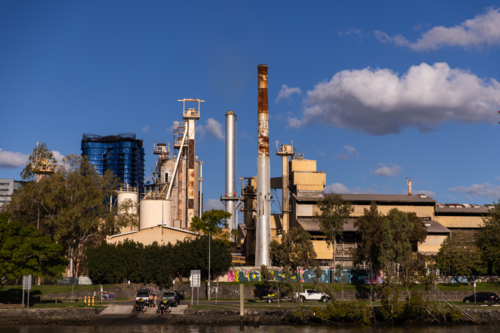 boat ramp and factory near the city centre on the Brisbane River - Australian Stock Image