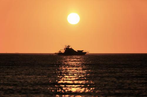 Boat silhouette at sunset - Australian Stock Image
