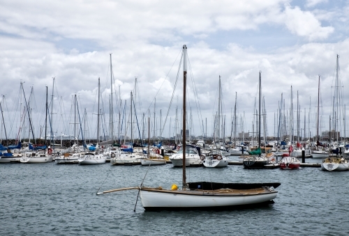 boats anchored in harbour with Melbourne skyline in background - Australian Stock Image