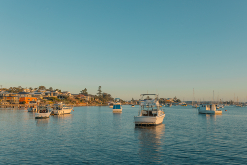 Boats anchored on Lake Maquarie at Belmont NSW - Australian Stock Image