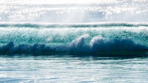 Light sea spray being blown on a perfect barrel - Australian Stock Image