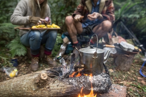 Boiling tea and breakfast over a camp fire
