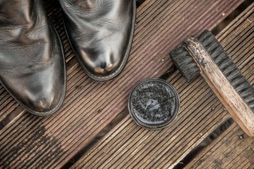 Boots and shoe polish and brush - Australian Stock Image